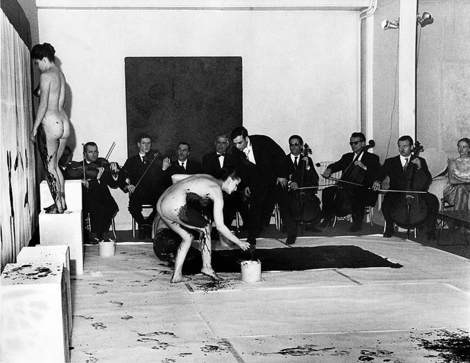 Harry Shunk. Yves Klein performance "Anthropometries of the Blue Period".1960. Showing orchestra, audience, naked models, and Klein. March 9, 1960. Gelatin silver print. 20.02 х 25.73 cm. Galerie d'Art Contemporain, Paris
