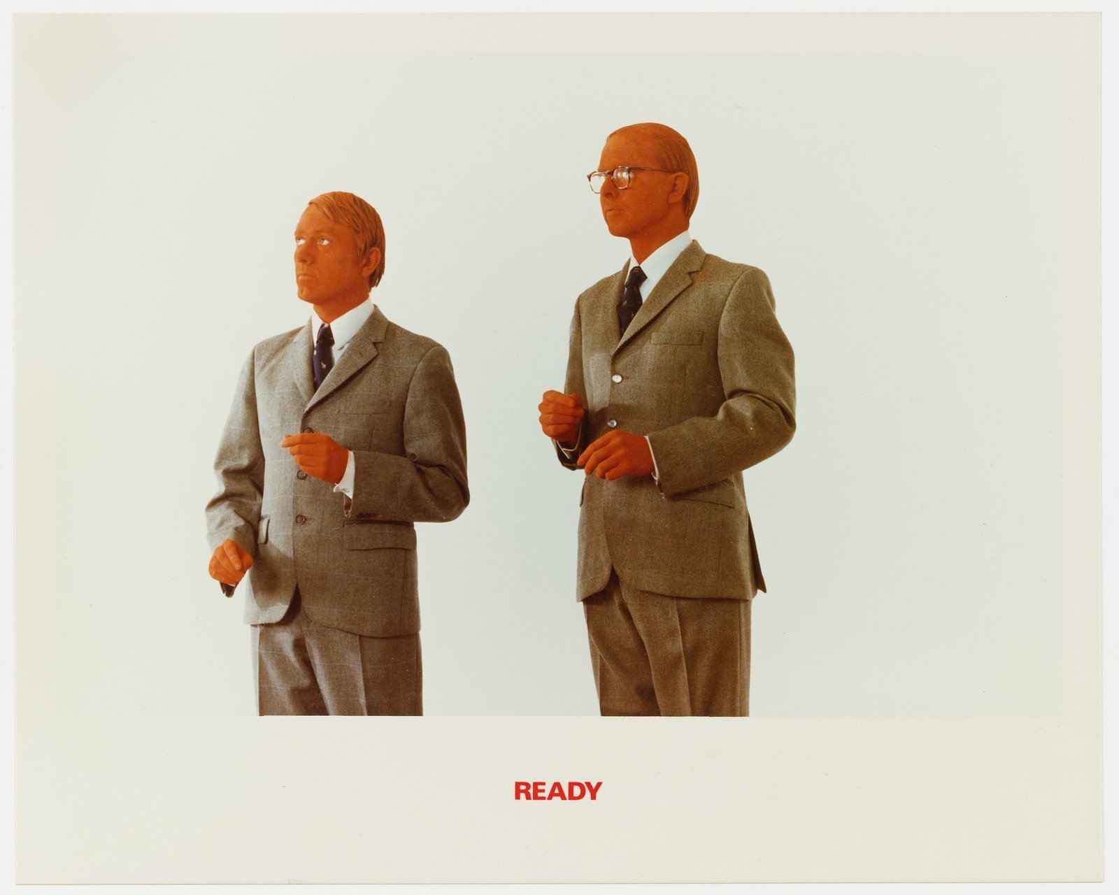 Гилберт и Джордж. Красная скульптура. 1975. Цветная фотография, текст. 23,2 &times; 35,2 см. Музей современного искусства, Нью-Йорк