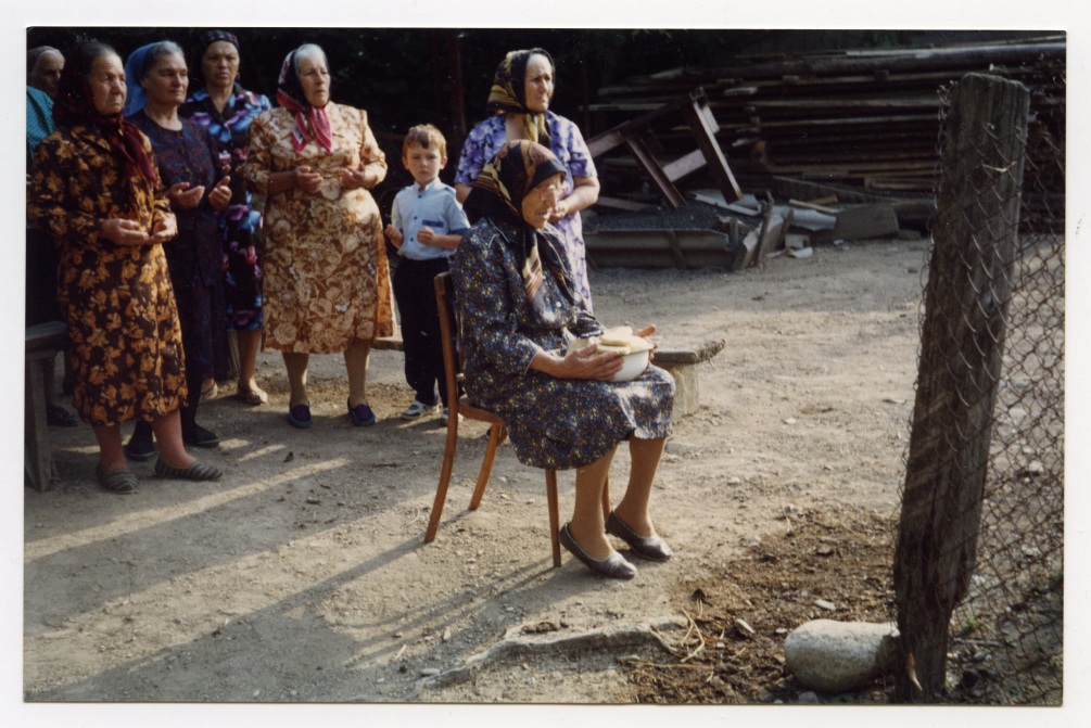 Unknown photographer, Khadzhet Salikhovna Sizo (Chuntyzheva) reads a prayer in the village of Khadzhiko, June 1995. Archive of Tamara Chuntyzheva
