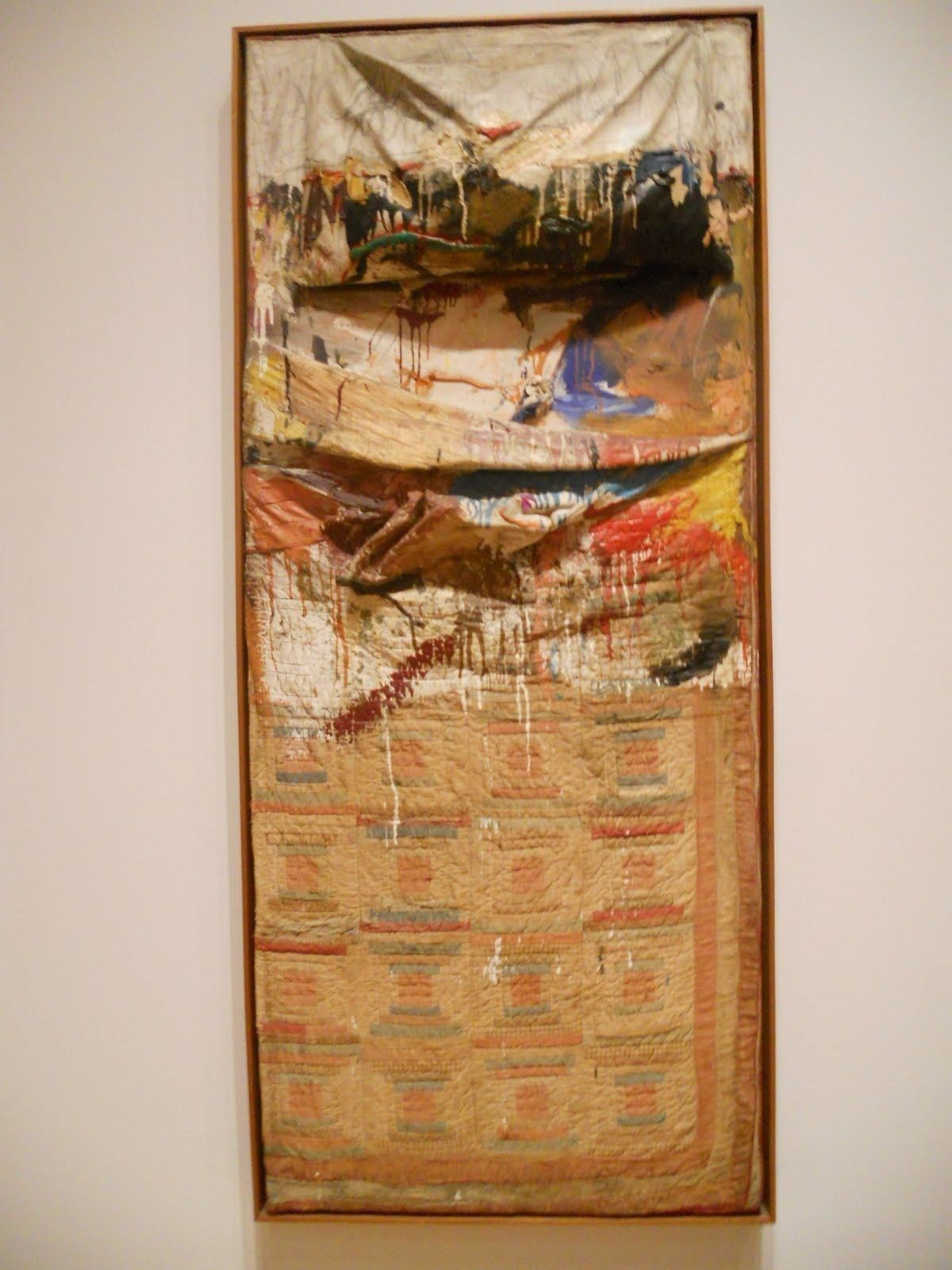 Robert Rauschenberg. Bed. 1955. Oil and pencil on pillow, quilt, and sheet on wood supports. 191.1 x 80 x 20.3 cm. The Museum of Modern Art (New York City, United States).
