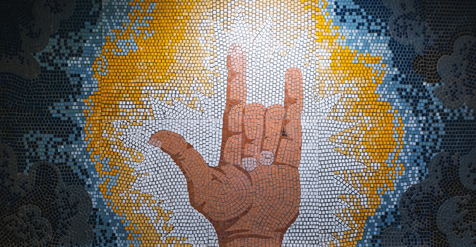 The mosaic depicts the sign "I love you" in International Sign&mdash;a contact variety of sign language used among deaf communities from different countries. Courtesy Moscow public municipal Kurchatov School, S.Y. Krivovyaz wing for hearing-impaired children №101. Photo: Anton Donikov